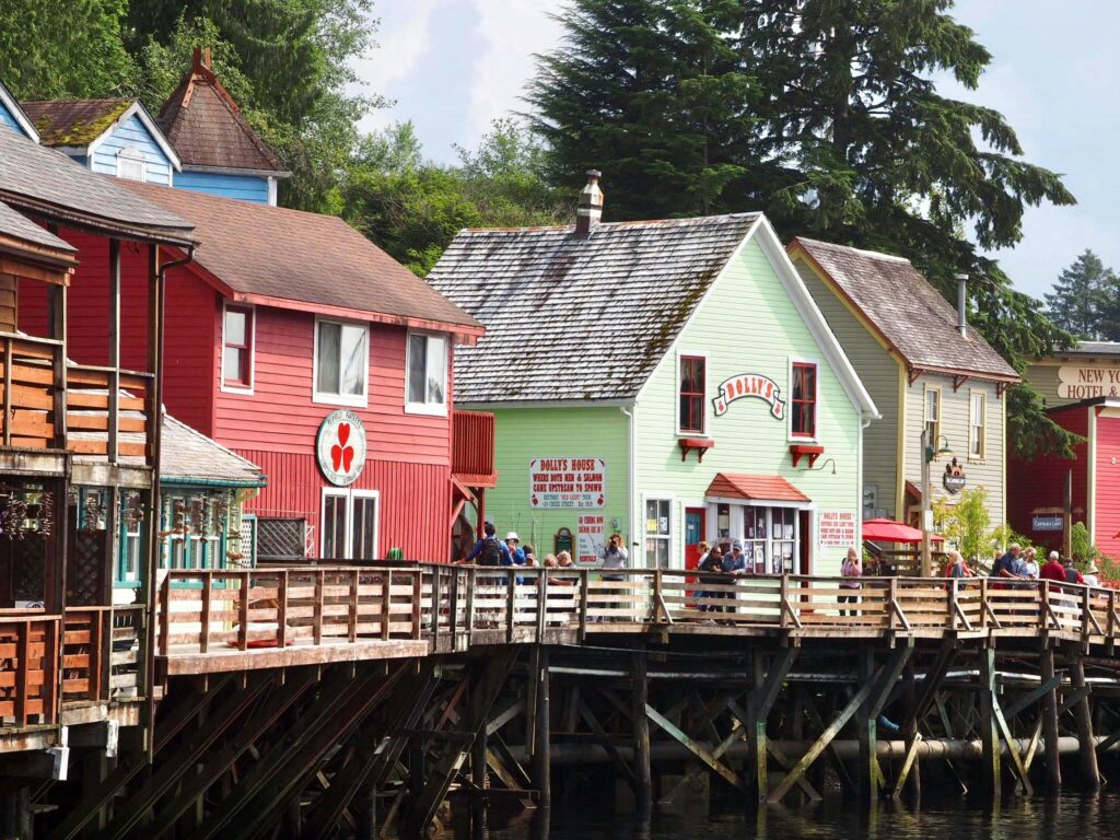Colorful wooden houses along Ketchikan's picturesque waterfront offer a glimpse into Alaska's charm.
