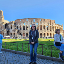 Woman standing in front of the Colosseum